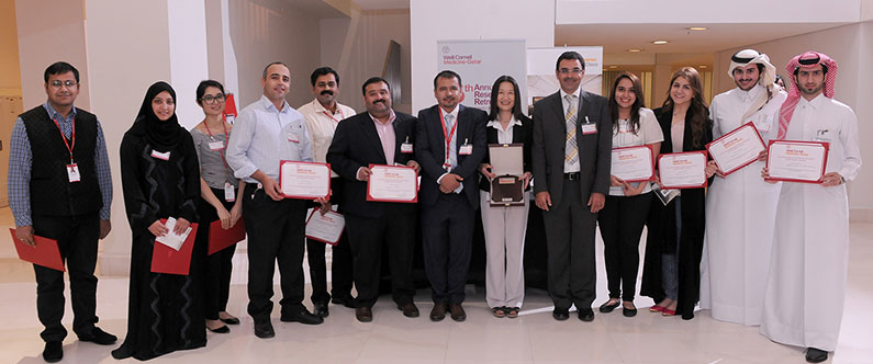 Dr. Khaled Machaca, associate dean for research, with the winners of the poster exhibition.