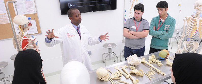 Dr. Mange Manyama, WCM-Q's assistant professor of anatomy in radiology, discusses human physiology with the students.