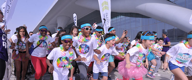 More than 8,000 people participated in the 'happiest 5k on the planet'.