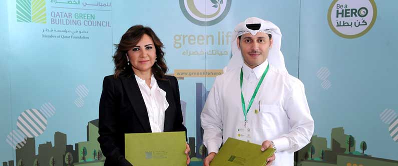 Nesreen Al-Rifai, WCM-Q’s chief communications officer, and Engineer Meshal Al Shamari,  QGBC director after signing the MoU.