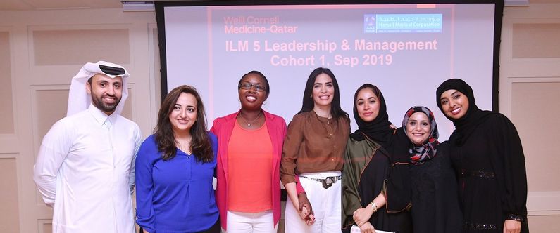 WCM-Q’s Director of Alumni Affairs, Haya Ahmad (center) with WCM-Q alumni who completed the leadership and management course.
