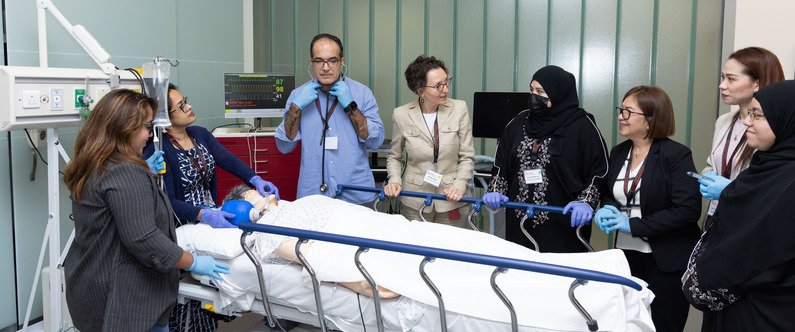 Course participants practicing their skills on a manikin.