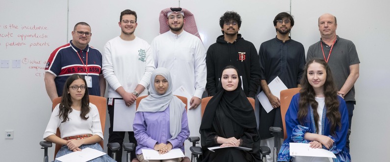 Dr. Sean Holroyd (right, standing) and Amjad Abdo (left, standing) with the students who participated in the Leadership Development program recently. 