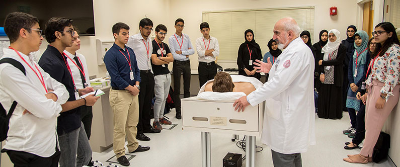 Dr. Mohamud Verjee, associate professor of family medicine in clinical medicine, discusses the human body using one of WCM-Q's state-of-the-art medical mannequins.