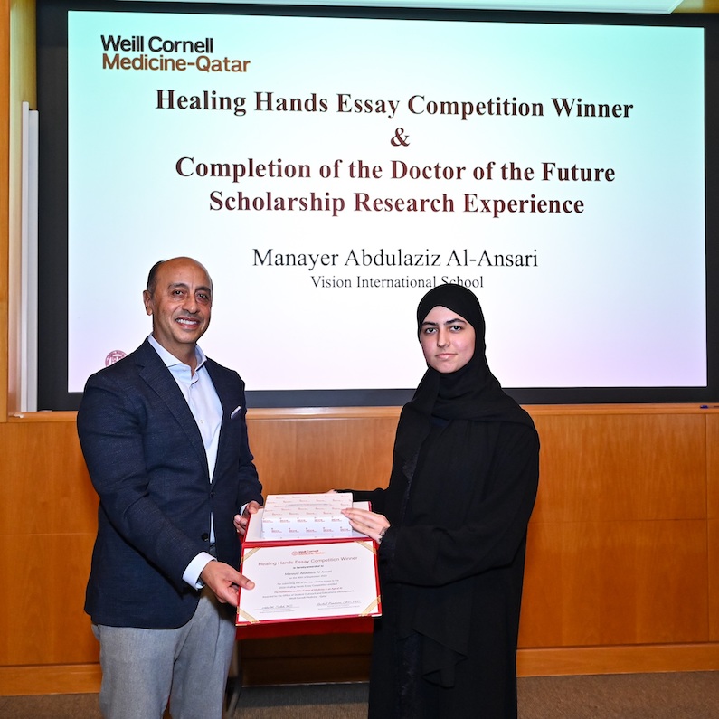 Dr. Rachid Bendriss with high school student Manayer Abdulaziz Al-Ansari, one of four winners of the Healing Hands essay contest and recipient of the Doctors of the Future scholarship. 