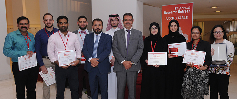 Dr. Nayef Mazloum and Dr. Khaled Machaca (center) with the winners of the poster presentations.