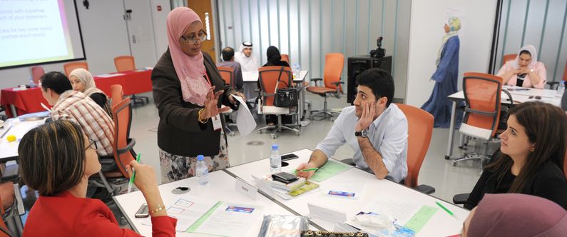 Huda Abdelrahim speaks with participants during the Mastering Emotional Intelligence course.