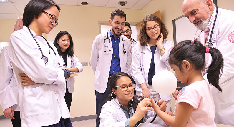 The students are shown how to perform a basic physical examination and the creative ways that pediatrician use to soothe the child.