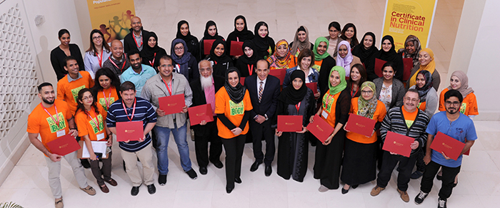 Dr. Ravinder Mamtani, Dr. Sohaila Cheema (middle) and participants holding their certificates in Clinical Nutrition.