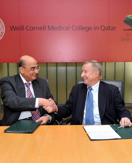 Dr. Mohammad Fathy Saoud and Dr. Antonio Gotto, Jr., exchange congratulations after the signing of the affiliation agreement.