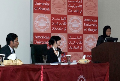 Watts and students at conference