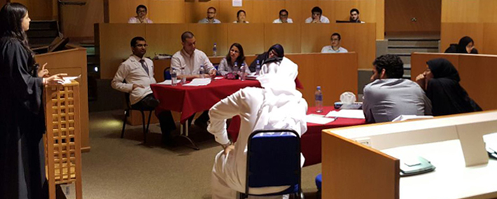 Second-year student and Debate Club president Eman AlMosleh argues her case at the dais