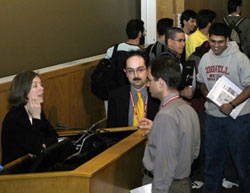 Dr. Ellen Julian talking to Dr. Marco Ameduri and Dr. Bogomil Gerganov