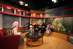 Amira El Sherif is interviewed as part of a mock current affairs program by a panel made up of Marwa Ahmed, Bothina Al Mulla, Aalia Al Barwani and Ali Saad.