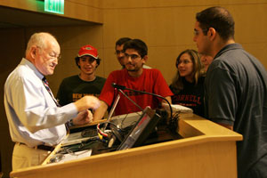 Following his lecture on sleep, Dr. Maas tells students about his adventures 'dune bashing' while in Qatar.