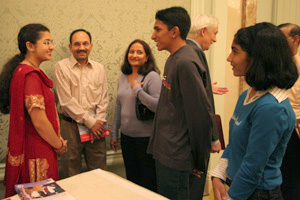 Medical student Manisha Deb Roy (left) explains the WCMC-Q application process to high school student
Pankit Vachhani (second from right).