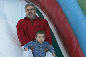 Dr. Pablo Rodriguez del Pozo and son Benjamin trying out the slide