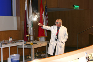 Professor of Chemistry, Dr. Frank Smith, demonstrates the interaction between electricity and living things.