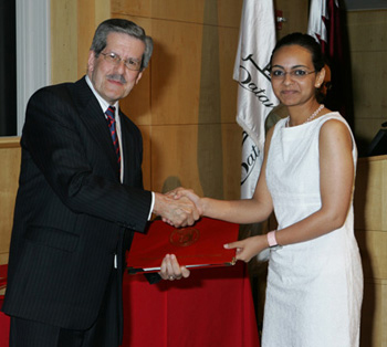 Dr. Alonso presented students with certificates to mark their completion of the Pre-medical Program. Here, Nayera Guirguis is congratulated.