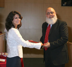 Maryam Shafaee (Class of 2008) presents Dr. Mohammed Tariq Butt with a certificate in recognition of his work as a preceptor.