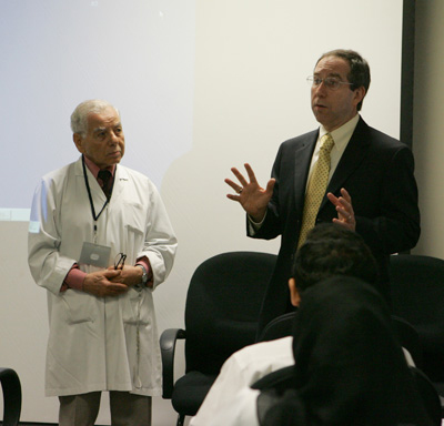 Dr. Granstein responds to questions from HMC physicians, with consultant dermatologist Dr. Mohammed Mohie at left.