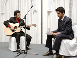 Karl Migally and Eshanjit Sapra perform at the Diplomatic Club for fellow students, faculty and staff.
