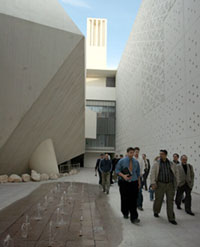 Inside and out: IMANA members tour the WCMC-Q building.