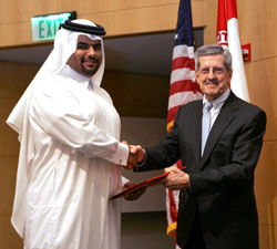 Khalid Al Mohannadi receives his certificate of achievement from Dr. Alonso.