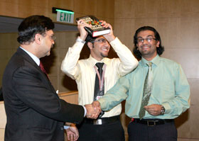 Mohamed El Shazly (center) and Nigel Pereira, Class of 2010, celebrate their first prize with Vice Dean for Research, Dr. Javaid Sheikh.