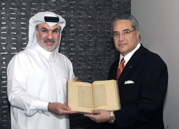 Dr. Nour (right) presents the book to Qatar Museum Authority CEO Abdulla al-Najjar