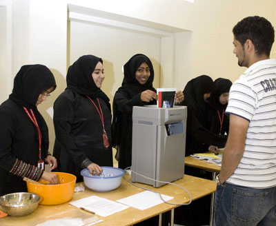 Recipe for success: Foundation students demonstrate paper recycling to a pre-med colleague.