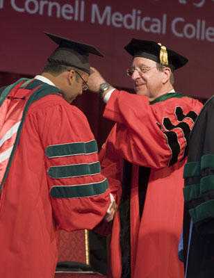 History in the making: President Skorton confers the Cornell University M.D. degree on Ibrahim Sultan.