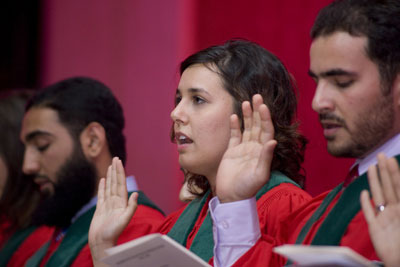 Reciting the Hippocratic Oath are (left to right) Ali Farooki, Rana Biary and Osama Alsaied.